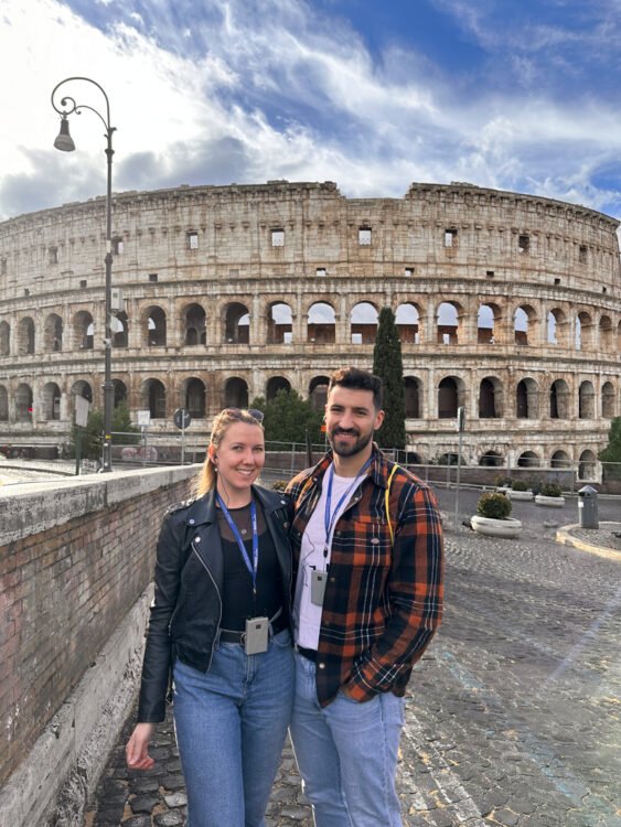 Klaudia and her boyfriend pose for a picture with the Colosseum in the background