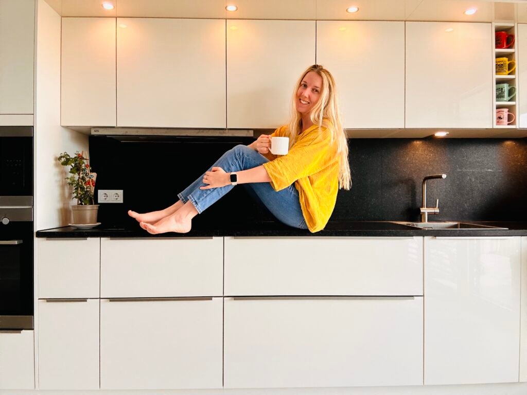 Klaudia sitting on the kitchen counter